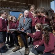 Angus Graham at the opening of the Thomas Graham Library in Strathblane with children from Strathblane Primary school.  Photograph by Colin Mearns