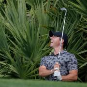 Rory McIlroy hits from the rough on the eighth (Marta Lavandier/AP)