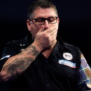 Two-time champion Gary Anderson, pictured, was knocked out by Chris Dobey