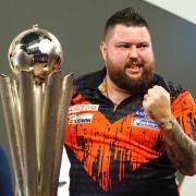 Michael Smith is not ready to give up his title as world champion just yet (Zac Goodwin/PA)