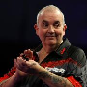Phil Taylor will officially retire from competitive darts in 2024 (Steven Paston/PA)