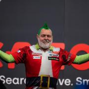 Peter Wright gets in the festive spirit every year at Ally Pally (Steven Paston/PA)