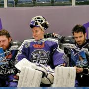 Glasgow Clan Finnish netminder Antti Karjalainen with fellow players, Charlie Combs, left and Ryan Harrison studying their foreign language phrase books