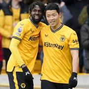Wolves striker Hwang Hee-Chan, right, celebrates with team-mate Boubacar Traore after scoring against Luton (Nick Potts/PA)