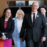 'She who must not be named in progressive company' and John Swinney arrive for FMQs