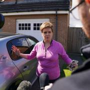 Nicola Sturgeon speaks to reporters outside her home on Friday