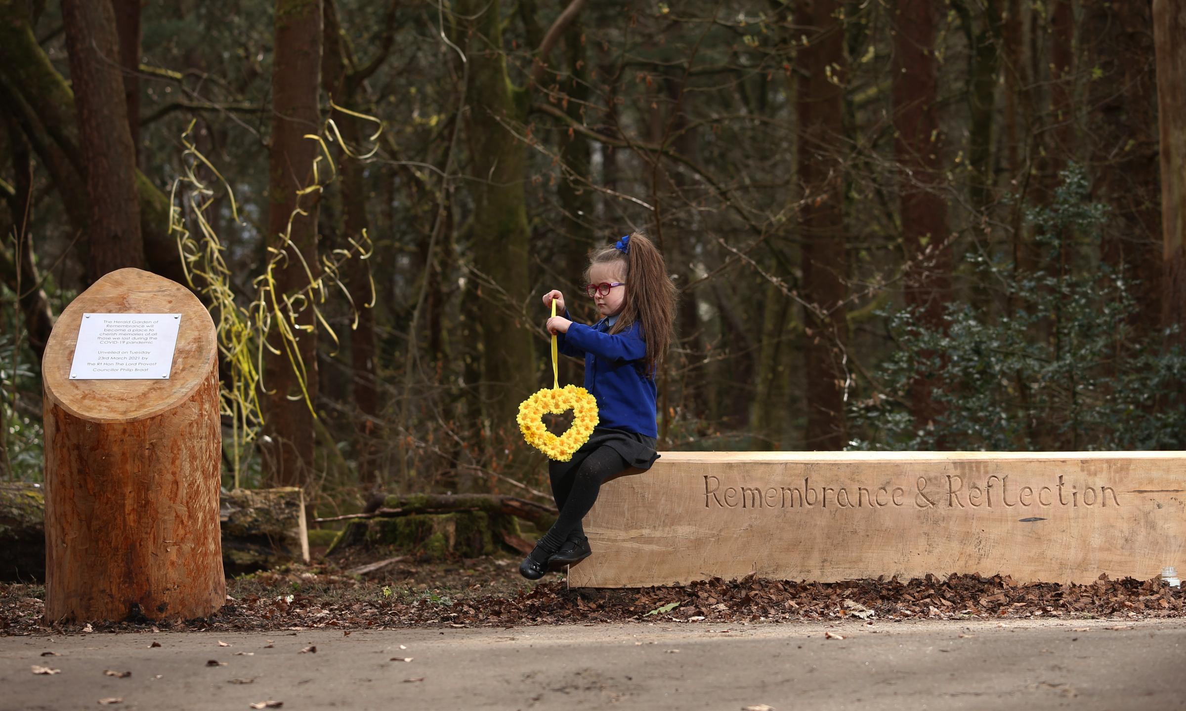 Jessica Machon, five, whose great uncle Jim Russell died from covid, at the garden. Photo by Gordon Terris.