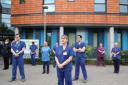 NHS staff take part in the silent tribute to fallen colleagues