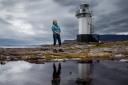 Writer Brigid Benson pictured at Rhue lighthouse on Loch Broom near Ullapool. Photograph by Colin Mearns