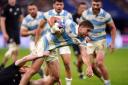 Argentina's Juan Cruz Mallia is tackled during the Rugby World Cup 2023 semi final match at the Stade de France