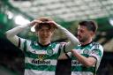 Kyogo Furuhashi, left, celebrates scoring against St Johnstone at Parkhead today with his team mate Greg Taylor