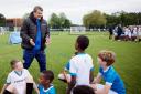 Scotland assistant manager John Carver speaks to kids taking part in the coaching programme which digital bank Chase have launched in conjunction with the SFA