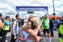 RUN DONE: Top, Sue Pilat and Jackie Thomson are reunited at the finish line.   Far left, 63-year-old Angelos Nikolopolous from Greece  crawled home, and left, one pair of runners are relieved at the end of the race. Pictures:  Julie Howden