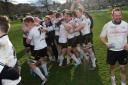 Melrose players celebrate after dramatically regaining the title they surrendered a year ago  Photograph: SNS