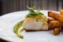 Herb crusted cod fillet with mint pea puree and handcut chips