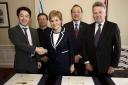 Nicola Sturgeon signs the deal with the Chinese firms earlier this year