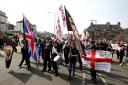 A group of far-right protesters march though Dover in Kent, the group are protesting against the arrival of immigrants; the Kent Anti-Racism Network have also organised a counter-demonstration.