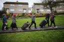 Syrian refugee families arrive on the Isle of Bute on December 4 last year