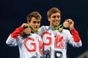 Great Britain's Tom Daley (right) and Daniel Goodfellow (left) celebrate with their bronze medals after the Men's Synchronised 10m Platform Final at the Maria Lenk Aquatics Centre on the third day of the Rio Olympic Games, Brazil. PRESS ASSOCIATIO