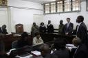 Jack Marrian with defence lawyer Andrew Wandabwa, speaking to the magistrate during the appearance at Kibera Law Court, Nairobi, in August. (AP)