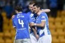 St Johnstone's Graham Cummins (right) celebrates his second goal with Blair Alston and Joe Shaughnessy. Picture: SNS