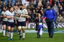 Scotland coach Vern Cotter and daughter Arrabella join the Scotland players on the pitch after the RBS 6 Nations match against Italy. Picture: Getty Images