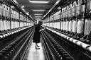 A worker monitors ring spinning machines at the Ferguslie Mills in 1966