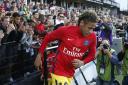 Supporters cheer PSG's Neymar as he arrives on the pitch ahead his French League One soccer match against Guingamp at the Roudourou stadium in Guingamp, western France, Sunday, Aug. 13, 2017. Neymar makes his long-awaited debut with Paris Saint-Germai