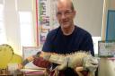 Council worker Steve O'Hara with a giant five-foot lizard that escaped death after being found on the roadside in Broughton, Peebleshire. See Centre Press story CPLIZARD; The fully-grown iguana was spotted in a roadside layby in a Peeblesshire village