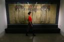 Assistant curator Hannah Willetts stands in front of The May Queen, a Gesso wall panel by Margaret Macdonald Mackintosh dating from 1900 Photograph by Colin Mearns 29 March 2018