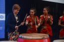 First Minister Nicola Sturgeon has a go on the drums with the Beijing Red Poppy Ladies Percussion Group at a Scotland reception to showcase the best of Scottish food, drink and culture in 2015.