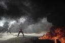 Palestinian protesters hurl stones at Israeli troops during a protest at the Gaza Strip's border with Israel, Friday, April 20, 2018. Two Palestinians were killed by Israeli troops health officials said. AP Photo/ Khalil Hamra