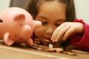 Teaching children how to manage their finances is thought to be key to financial inclusion. Picture: Anthony Devlin / PA.