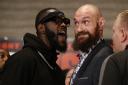 Boxers Deontay Wilder, left, and Tyson Fury exchange words as they face each other at a news conference in Los Angeles, Wednesday, Nov. 28, 2018. The pair are slated to fight Saturday night for Wilder's WBC heavyweight title. (AP Photo/Damian Dovargan