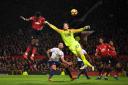 MANCHESTER, ENGLAND - DECEMBER 30: Paul Pogba of Manchester United beats Asmir Begovic of AFC Bournemouth as he scores his team's second goal during the Premier League match between Manchester United and AFC Bournemouth at Old Trafford on December 30,