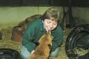 Volunteer Sandra Hutt with one of the foxes in their care.