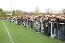 A record crowd of 1,587 turned out to watch Merstham take on AFC Wimbledon at the Recreation Ground on Saturday.