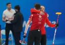 Great Britain's Jennifer Dodds and Bruce Mouat celebrate winning their mixed doubles match against Canada