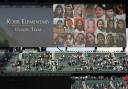 Photos of the victims of the shooting at Robb Elementary School in Uvalde, Texas, are shown on a video display at T-Mobile Park Friday, May 27, 2022, during a moment of silence before a baseball game between the Seattle Mariners and the Houston Astros in
