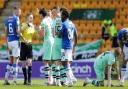 Referee Craig Napier is surrounded by Hibs players after controversially sending off Jimmy Jeggo.