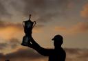 Wyndham Clark of the United States poses with the trophy after securing victory in the final round of the 123rd US Open Championship at The Los Angeles Country Club