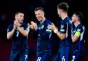 Callum McGregor, centre, and his Scotland team mates applaud the Tartan Army after their win over Georgia on Tuesday night