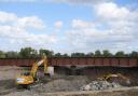 HS2 contractors excavate an area below a newly replaced section of the Aylsebury to Princes Risborough branch line track