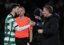 Celtic winger Mikey Johnston shakes Brendan Rodgers' hand during the Hibernian game on Wednesday night