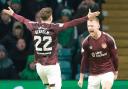 Stephen Kingsley, right, celebrates scoring against Celtic at Parkhead on Saturday with his Hearts team mate Aidan Denholm