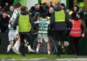 Paulo Bernardo celebrates with the Celtic fans after hitting the opening goal against Rangers.