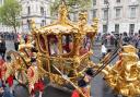 King Charles III and Queen Camilla in the Gold State Coach on Coronation Day last year