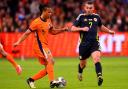 John McGinn, right, in action for Scotland against the Netherlands in Amsterdam on Friday night