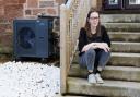 Nina Murray pictured at home in the Southside of Glasgow. Nina has had her home retrofitted with an air source heat pump (pictured at left) and extra insulation.    ..  Photograph by Colin Mearns.28th March 2024.For Herald on Sunday, see story by Vicky