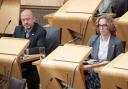 Greens co-leaders Patrick Harvie and Lorna Slater pictured in the Scottish Parliament yesterday after Humza Yousaf had announced the ending of the Bute House Agreement